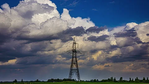 Majestic rolling cloud and sky timelapse behind an electric transmission tower Stock Footage 300266101