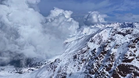 Majestic Snow-Capped Mountains with Dramatic Cloud Background Stock Footage 333312697