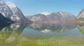 Majestic snowy Alps under blue cloudless sky, clear lake, vacation in mountains 4k or 4k+ Resolution