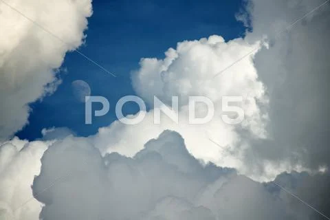 Majestic Storm Clouds with Moon Stock Photos