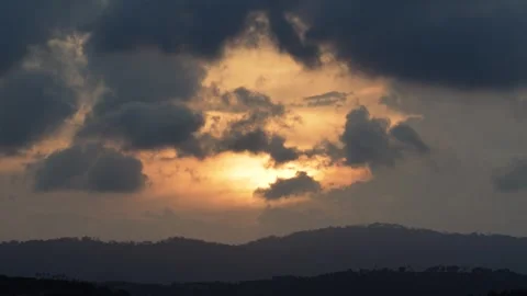 Majestic Sunset Over Mountain Range, Cloudy Sky Emitting Golden Rays Stock Footage 264348388