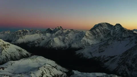Majestic Sunset Over the Snowy Peaks of the Greater Caucasus Mountains, Russia Stock Footage 320856437