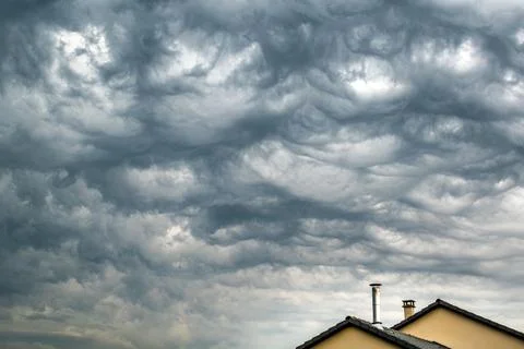 Majestic thundercloud by a stormy weather, dramatic dark scene Stock Photos