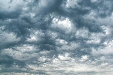 Majestic thundercloud by a stormy weather, dramatic dark scene Stock Photos