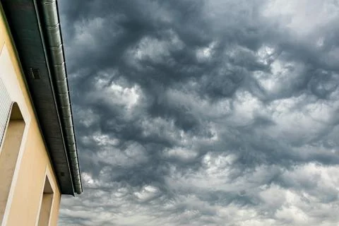 Majestic thundercloud by a stormy weather, dramatic dark scene Stock Photos