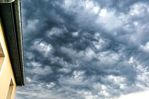 Majestic thundercloud by a stormy weather, dramatic dark scene Stock Photos
