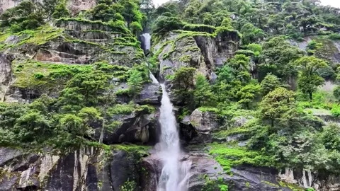 Majestic Waterfall Cascading Down Lush Green Mountainside Tibet China 動画素材 346737643