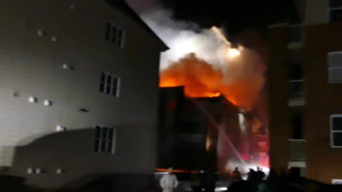 Major apartment building fire Stock Footage 125452788