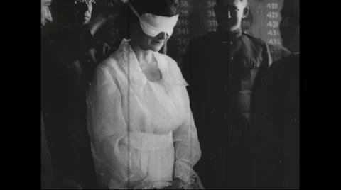 Major Billie Welborn being blind folded before drawing draft number Stock Footage
