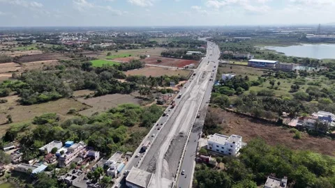 A major highway construction project near Chennai, with new sections and Stock Footage 313276548