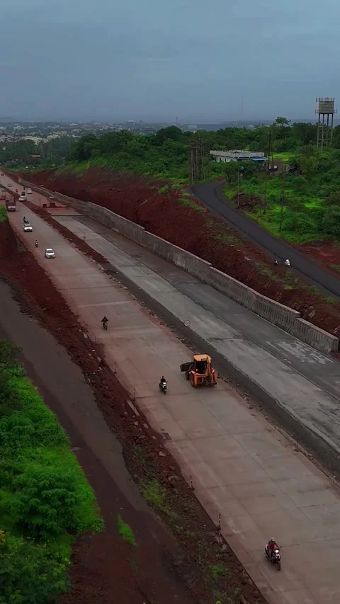 Major Highway Under Construction in a Developing Area. Vertical Aerial View Stock Footage 324810709