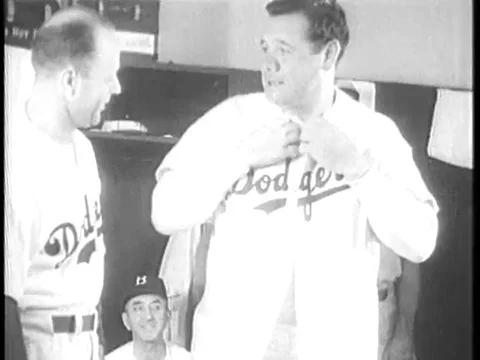 Major League Baseball player Babe Ruth suits up, warms up and coaches first Stock Footage 74934038