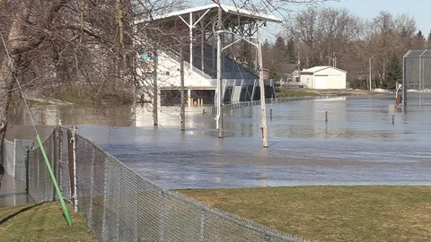 Major river flooding during record warm temperatures in Ontario Canada Stock Footage 150244624