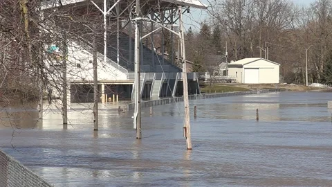 Major river flooding during record warm temperatures in Ontario Canada Stock Footage 150244698