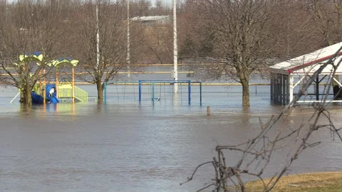 Major river flooding during record warm temperatures in Ontario Canada Stock Footage 150245273