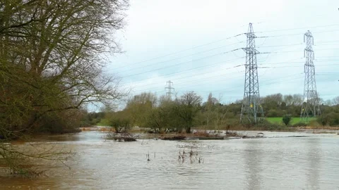 Major river overflow after intense rainstorm inundating riverside parkland and Stock Footage 332218919