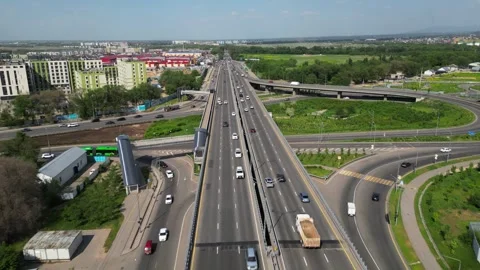 A major road interchange with 6 lanes for traffic. Stock Footage 308992886
