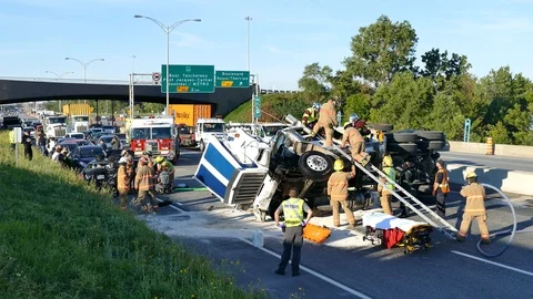Major rollover crash with tractor trailer driver trapped inside rolled over Stock Footage 113326441