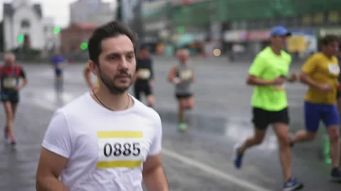 Major running competition with crowds, groups of athletic runners and sportsmen. Stock Footage 166496941