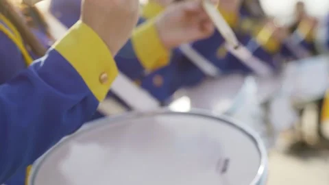 Majorets are lined and knocking out the melody. Street performance on the drums Stock Footage 243317455