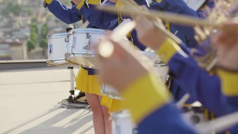 Majorets are lined and knocking out the melody. Street performance on the drums Stock Footage 243317786