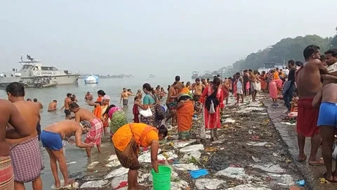 Makar Sankranti ,Ganges bathing  by hindu  devotees Stock Footage 230261949