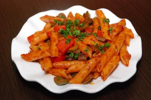 Makaroni with tomato paste Stock Photos