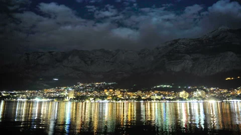 Makarska at night, the reflection of lights along the beach. Stock Footage 57865929