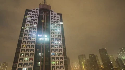 Makati: Building with Clouds during Night Stock Footage 69151744