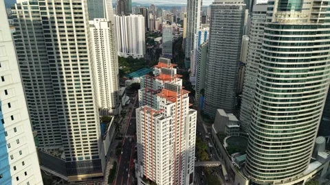 Makati CBD Drone Flyover Between Residential Towers at Daytime 스톡 동영상 331051899