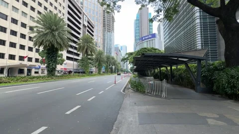 Makati CBD public transit bus lane text markings on asphalt road 4K Stock Footage 337448959