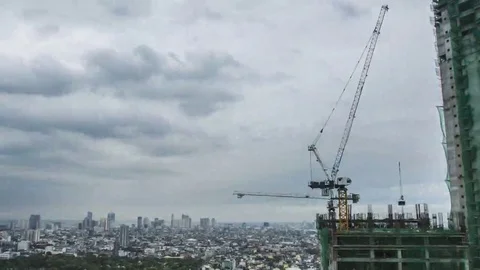 Makati: City Construction Crane with Clouds during Day, Wide Stock Footage 69211851
