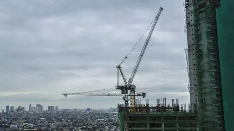 Makati: City Construction Crane with Clouds during Day Stock Footage 69232771