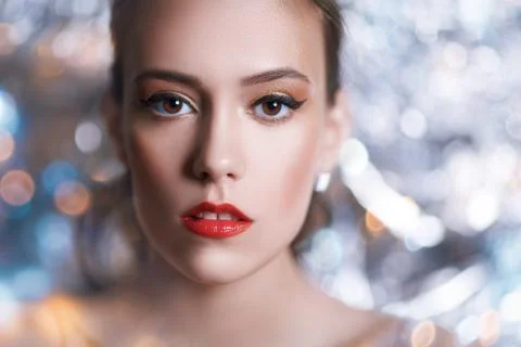 Make-up and cosmetics. Close-up portrait of a gorgeous young woman with golde Stock Photos