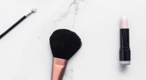 Make-up and cosmetics flatlay on marble Stock Photos