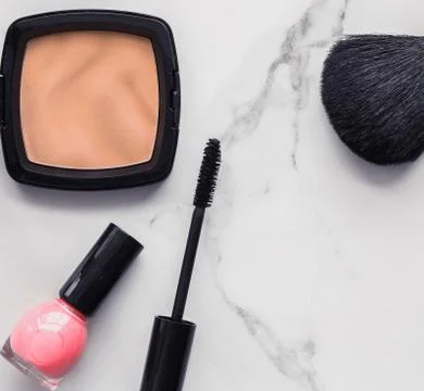 Make-up and cosmetics flatlay on marble Stock Photos