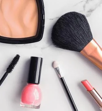 Make-up and cosmetics flatlay on marble Stock Photos