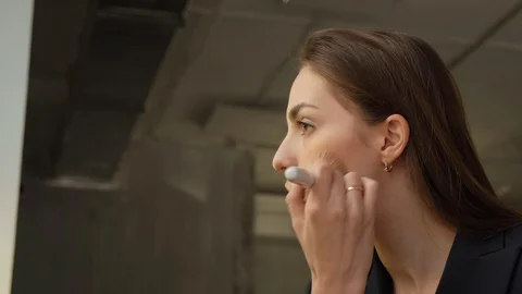 Make up applying. Face powder, facial makeup. Rouging young attractive girl Video stock 129637939