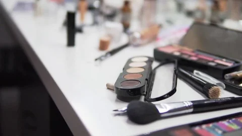 Make up artist accessories are gradually revealed as the camera slowly tilts Stock Footage 71812346