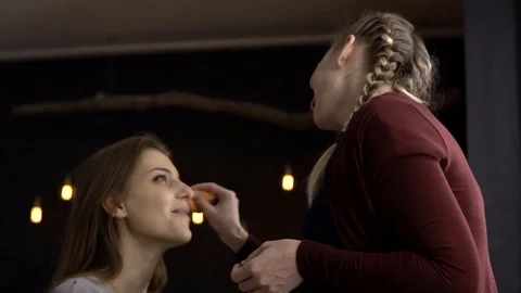 Make-up artist applies blush on the model Stockbeeldmateriaal 85756876