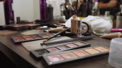 Make-up artist applies eye shadow on background Professional make-up tools. A Video stock 81047022