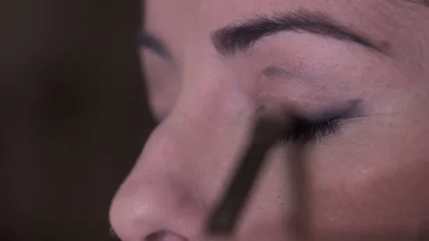 Make up artist apply eyeshadow with brush, close up Stock Footage 74689307