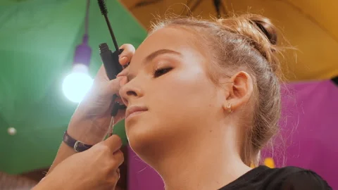 Make-up artist apply makeup with brush - closeup Stock Footage 157496206