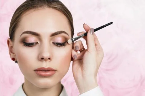 Make-up artist applying eyeshadow Stock Photos
