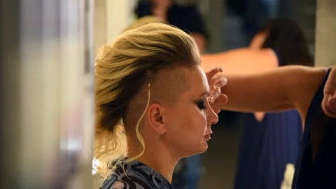 Make-up artist applying eyeshadow using finger Stock Footage 293055314