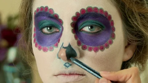 Make-up artist applying Halloween face art Stock Footage 82720371