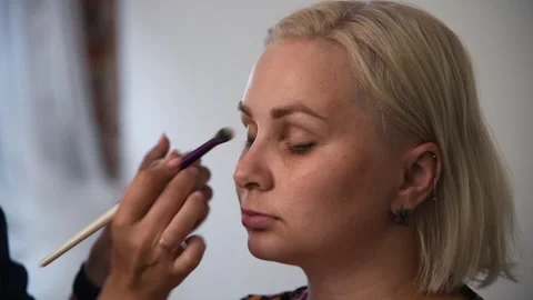 Make-up artist applying make-up foundation Stock Footage 255399544
