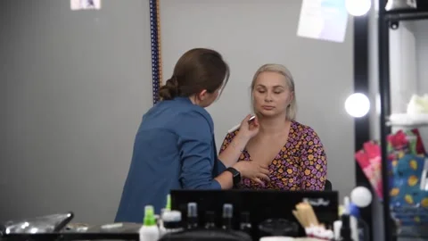 Make-up artist applying make-up foundation Stock Footage 255399980