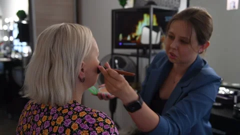 Make-up artist applying make-up foundation Stock Footage 255400504