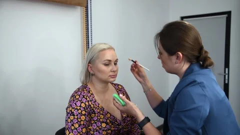 Make-up artist applying make-up foundation Stock Footage 255400726